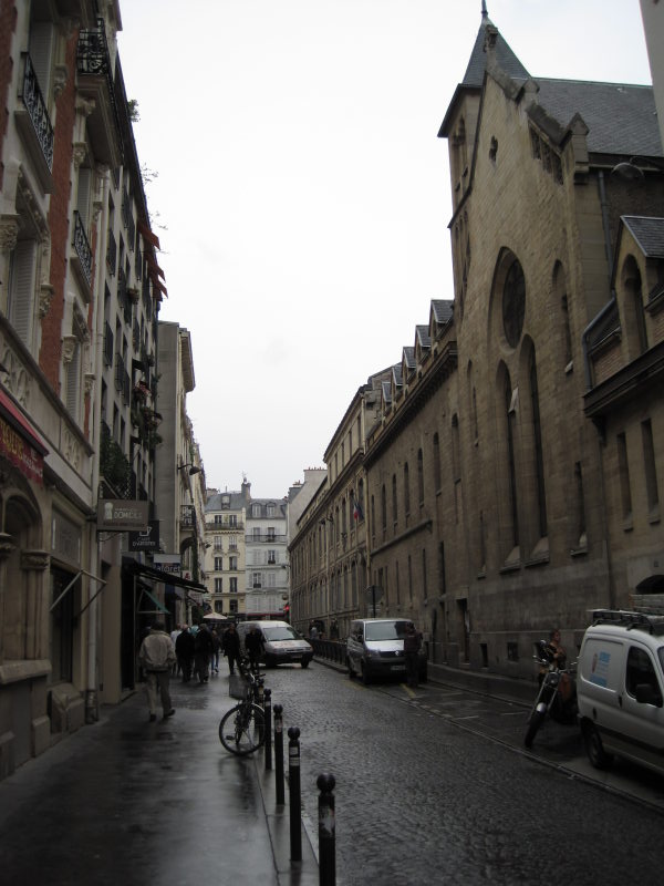 [Rain-streaked streets --  ...]