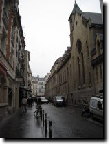 [ Rain-streaked streets --  ... ]
