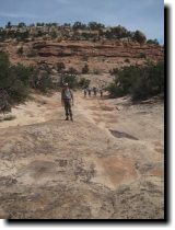 [ Hiking through a potholed ... ]
