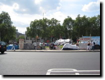 [ Protest across the street ]