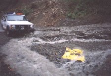 [Ranger crossing flooded road]